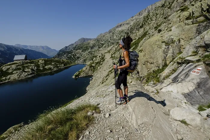 Framed Print : Hiker on Bachimana reservoir, Ibones azules and Bachimana alto route Framed Print : Hiker on Bachimana reservoir, Ibones azules and Bachimana alto route