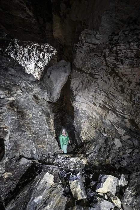 Framed Print : Hiker explores Obstans ice cave in Alta Pusteria