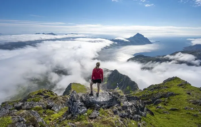 Framed Print : Hiker looking over mountain landscape in clouds Framed Print : Hiker looking over mountain landscape in clouds