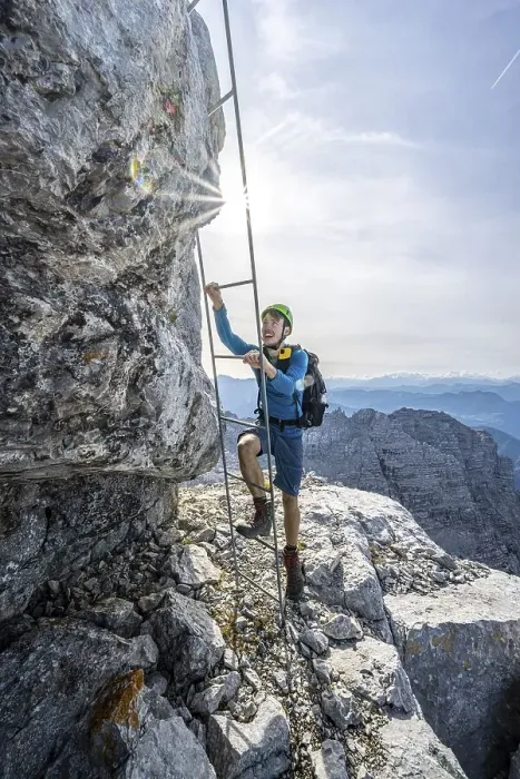 Framed Print : Hiker in a secured path, climbing a ladder