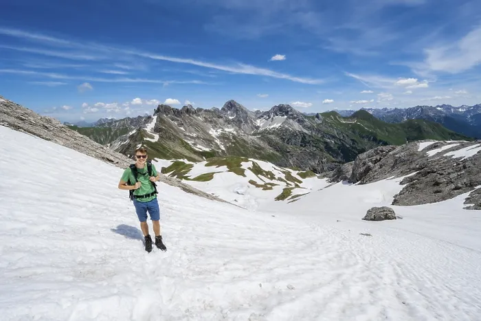 Framed Print : Hiker on a snow field, mountaineer on the hiking trail