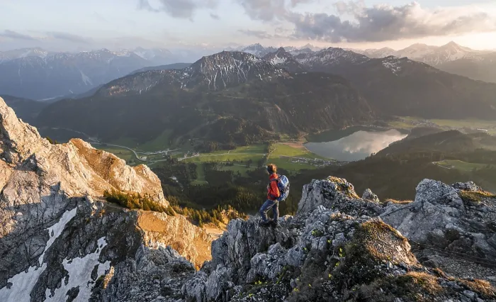 Framed Print : Hiker at the summit of Schartschrofen at sunset