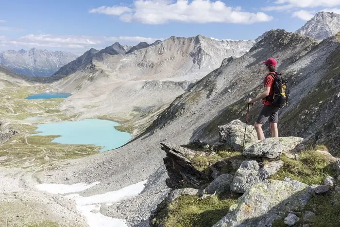 Framed Print : Hikers on the Joeriflueelafurgga with view of the Joerisee lakes