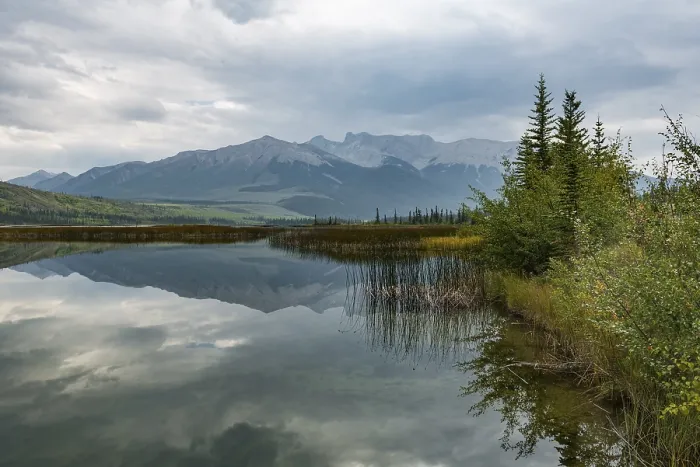 Framed Print : Hilly landscape reflected in a lake