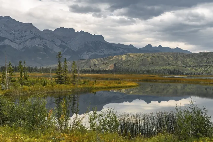Framed Print : Hilly landscape reflected in a lake