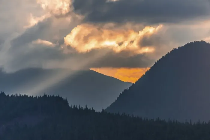 Framed Print : Hilly wooded mountain landscape at sunset with dramatic clouds Framed Print : Hilly wooded mountain landscape at sunset with dramatic clouds