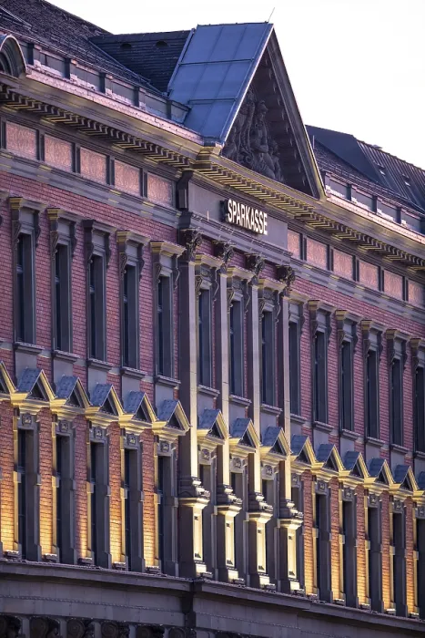 Framed Print : Historic building with brick facade and classic architecture in sunlight