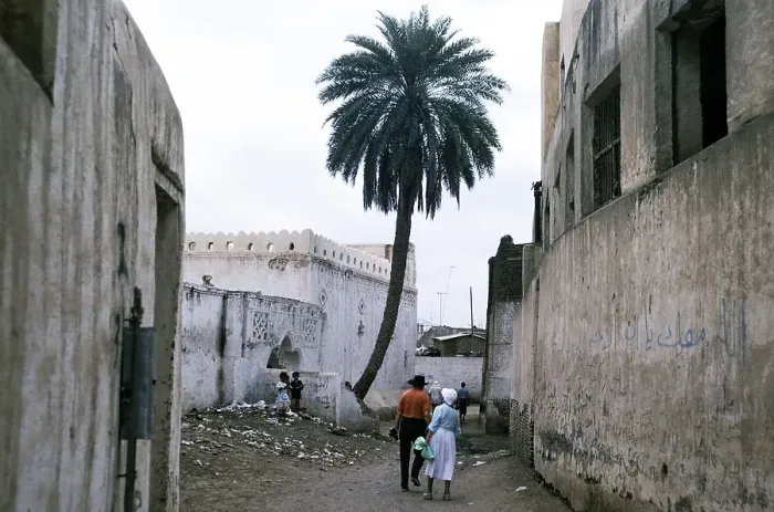 Framed Print : Historic buildings in the ancient city of Zebid, Zabid, Yemen 1998 UNESCO World Heritage Site Tourists explore streets