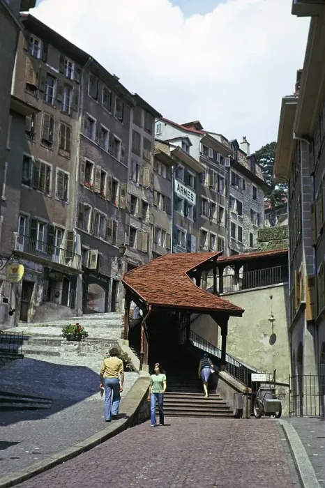 Framed Print : Historic buildings in the old town centre of Lausanne, Switzerland, 1974 covered staircase on the street, Europe