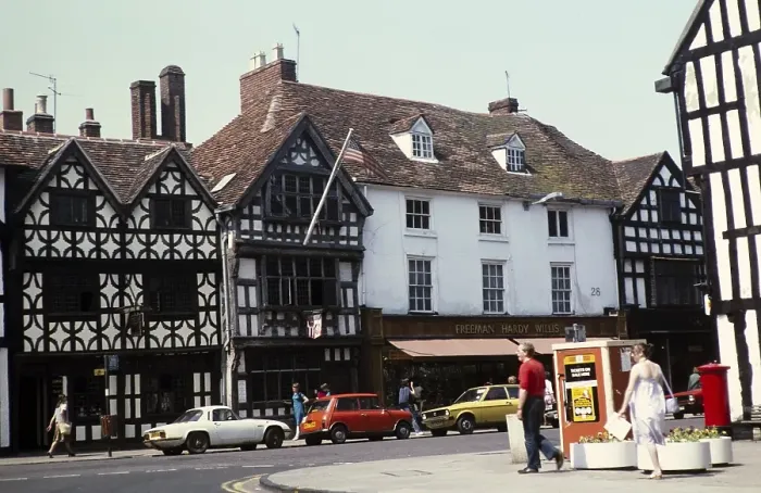 Framed Print : Historic buildings Tudor facades, High Street, Stratford on Avon, Warwickshire, England, UK 1982 including Freeman Hardy Willis shop