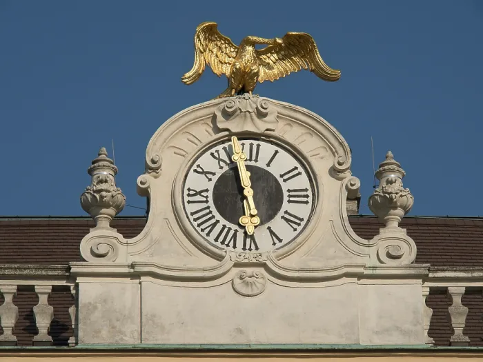 Framed Print : Historic clock with gilded eagle on a building against a clear sky Framed Print : Historic clock with gilded eagle on a building against a clear sky