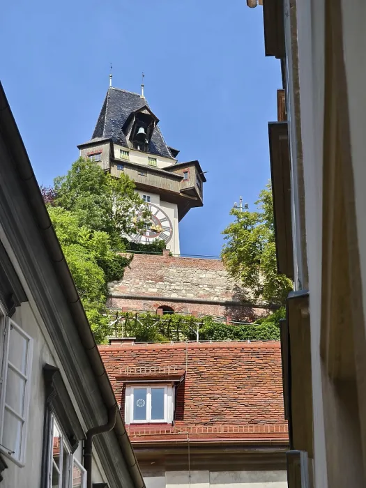 Framed Print : Historic clock tower towers over rooftops