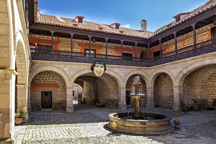 Framed Print : A historic courtyard with a central fountain and arches