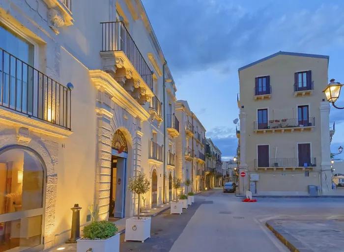 Framed Print : Historic district traditional buildings illuminated at dusk