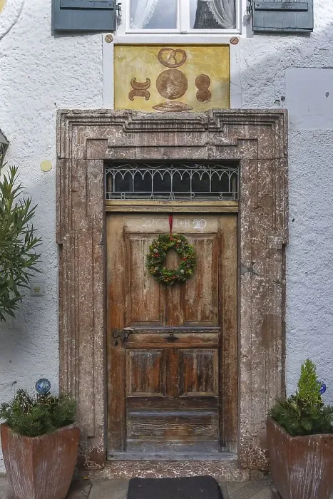 Framed Print : Historic entrance door of a former bakery on Fraueninsel