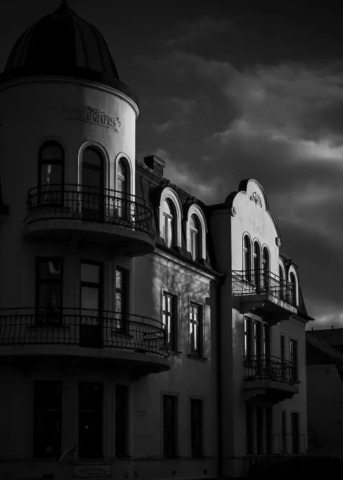 Framed Print : Historic European building in black and white with dramatic shadows and cloudy sky in Helsingborg