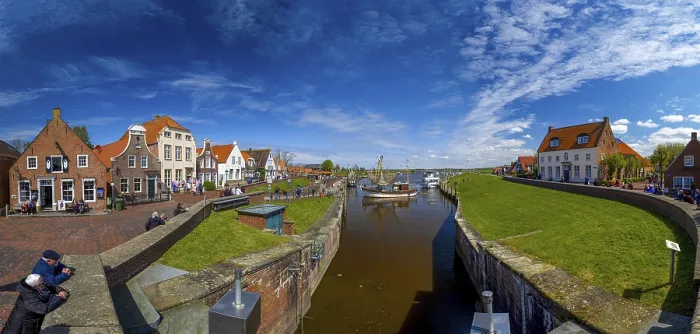 Framed Print : Historic houses at Greetsiel harbour