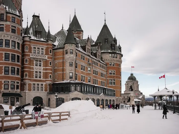 Framed Print : Historic le Chateau Frontenac building with snow-covered ground and people