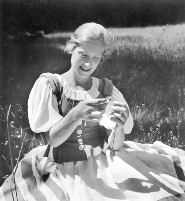Framed Print : Historic photo, woman plucking petals, ca. 1940