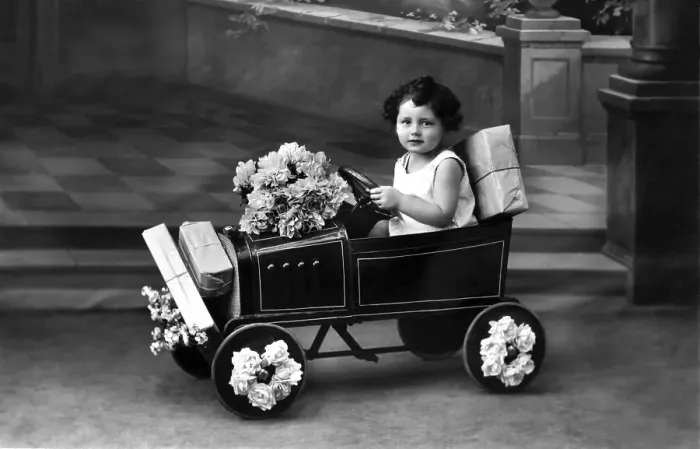 Framed Print : Historic photograph, child in a toy car