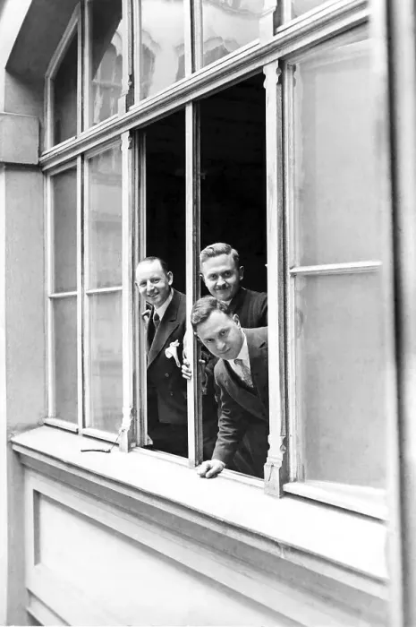 Framed Print : Historic photograph, three men looking out of a window