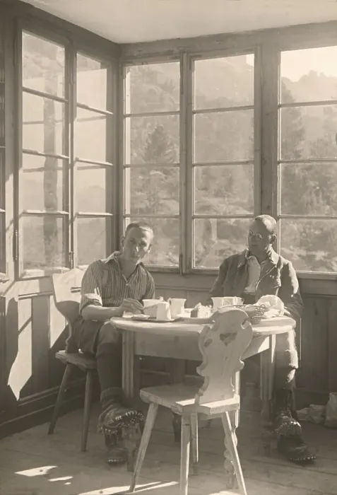 Framed Print : Historic photograph of a mountain climber taking a break at an alpine restaurant