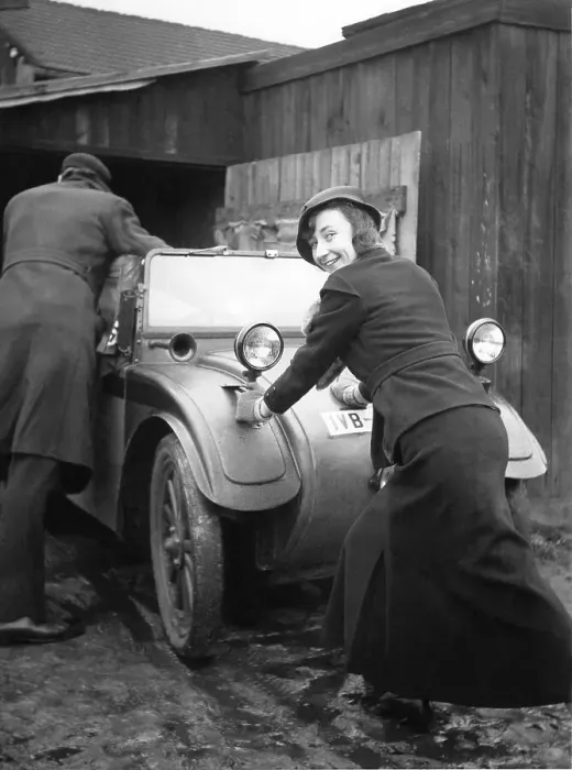 Framed Print : Historic photograph, woman pushing a car