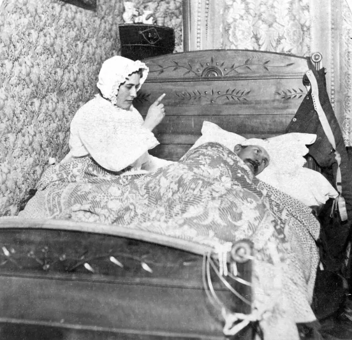 Framed Print : Historic photograph, woman scolding her husband in bed