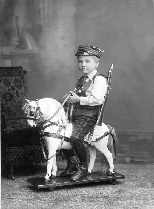 Framed Print : Historic photograph, young boy sitting on a rocking horse Framed Print : Historic photograph, young boy sitting on a rocking horse