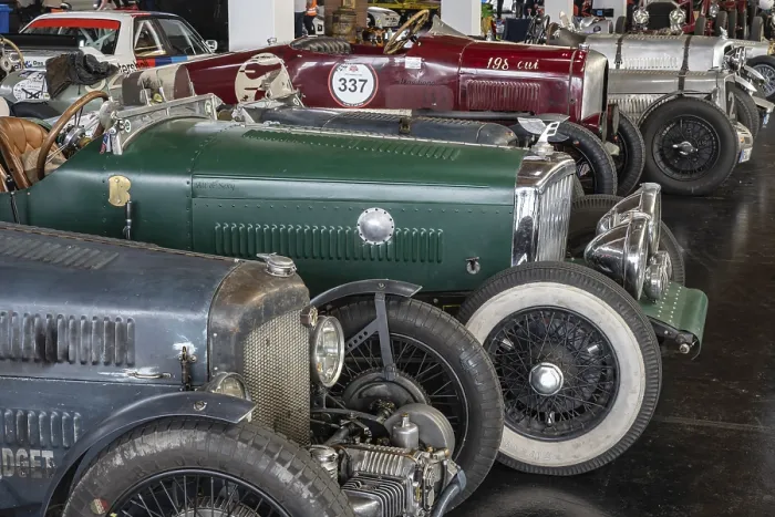 Framed Print : Historic racing cars lined up in a car park