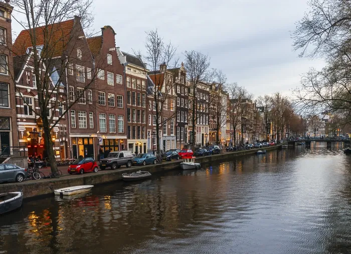 Framed Print : Historic row of houses on a canal at dusk
