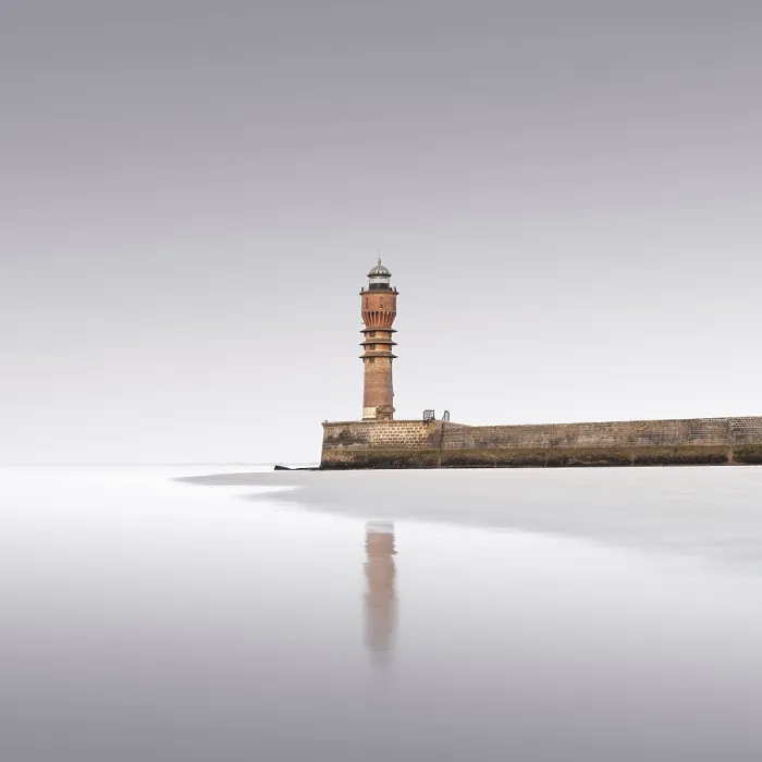 Framed Print : The historic Saint-Pol lighthouse at dusk on Dunkerque beach