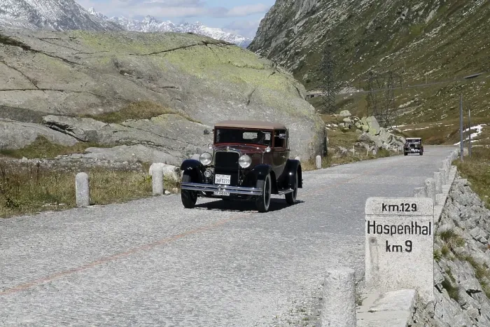 Framed Print : Historic section of cobblestone pavement on the old Gotthard pass route with milestone to Hospental and Oldtimer