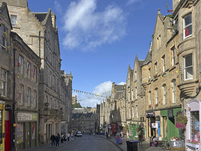 Framed Print : Historic street lined with old buildings under a clear sky Framed Print : Historic street lined with old buildings under a clear sky