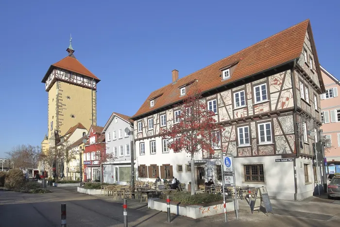 Framed Print : Historic Tubingen Gate built in 1330 and half-timbered house with street shop