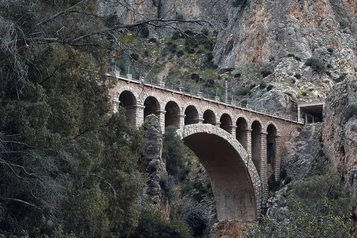 Framed Print : Historic viaduct in a rocky, wooded landscape on the Caminito del Rey path