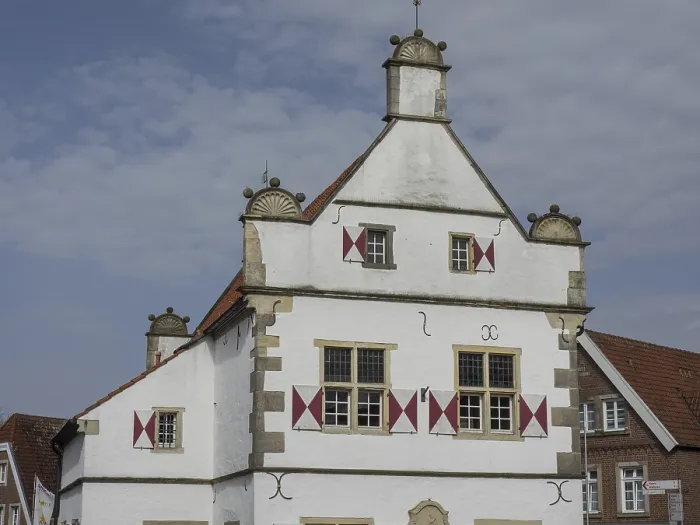 Framed Print : Historic, white and red half-timbered house with ornate windows