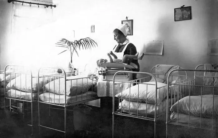 Framed Print : Historical photo, nurse and baby in the hospital Framed Print : Historical photo, nurse and baby in the hospital