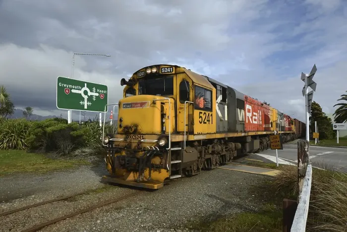 Framed Print : HOKITIKA, NEW ZEALAND, AUGUST 29, 2020: A freight train crosses the main street of Hokitika near the roundabout on State Highway 6 Framed Print : HOKITIKA, NEW ZEALAND, AUGUST 29, 2020: A freight train crosses the main street of Hokitika near the roundabout on State Highway 6