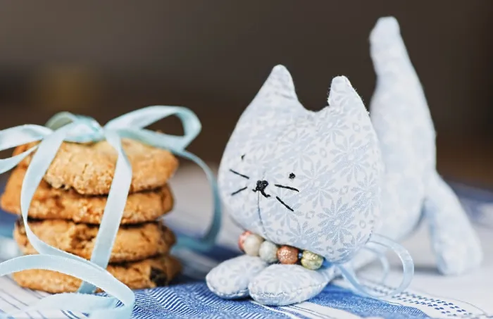 Framed Print : Homemade puppet, a cat and cookie on tablecloth Framed Print : Homemade puppet, a cat and cookie on tablecloth
