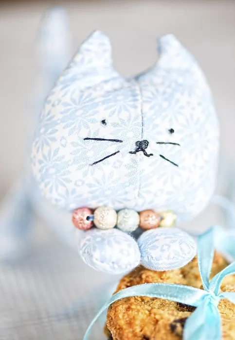 Framed Print : Homemade puppet, a cat and cookie on tablecloth Framed Print : Homemade puppet, a cat and cookie on tablecloth