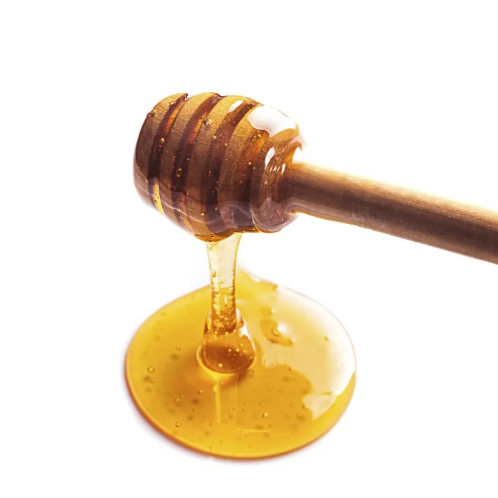 Framed Print : Honey drip isolated on white background