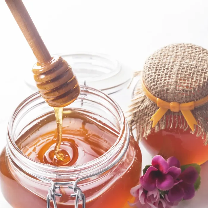 Framed Print : Honey drip and jar on white backround Framed Print : Honey drip and jar on white backround