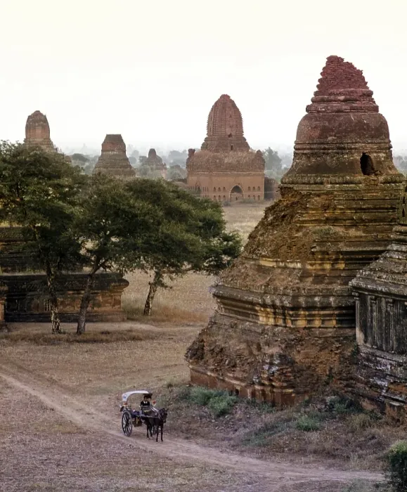 Framed Print : Horse-drawn carriage in a field with ruins of Buddhist pagodas and temples Framed Print : Horse-drawn carriage in a field with ruins of Buddhist pagodas and temples