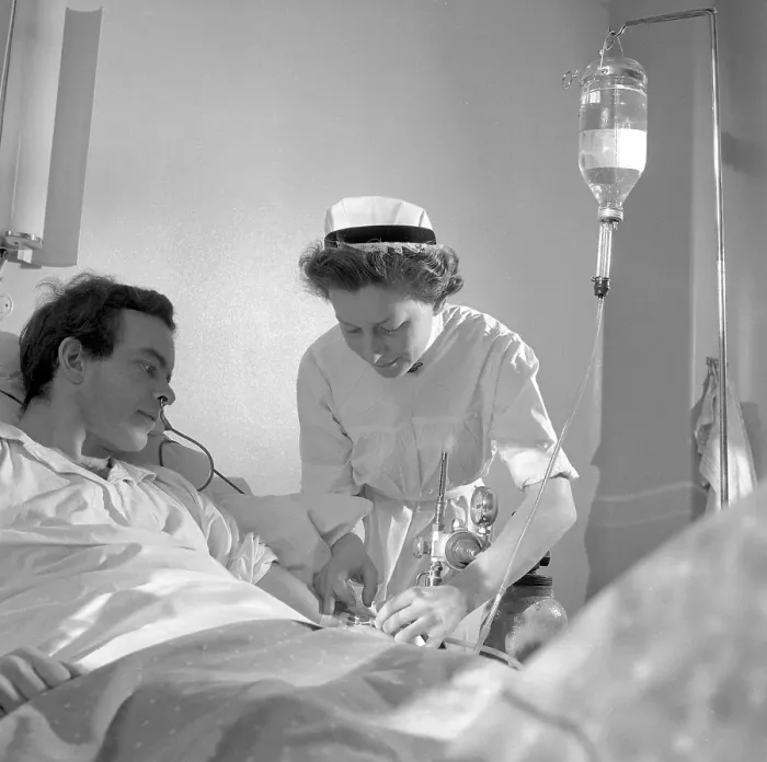 Framed Print : Hospital in the 1950s. A nurse is giving a patient intravenous therapy. Sweden 1952 Conard ref 1931