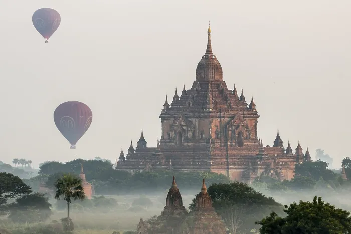 Framed Print : Hot air balloons over the landscape in the early morning fog