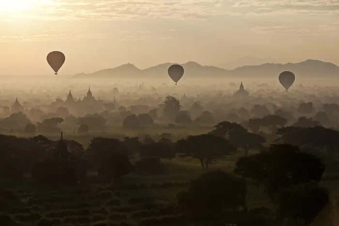 Framed Print : Hot air balloons over landscape with stupas Framed Print : Hot air balloons over landscape with stupas
