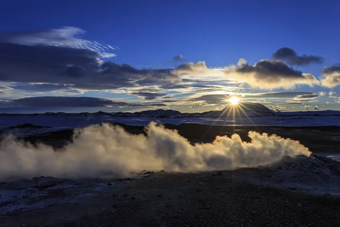 Framed Print : Hot springs and geothermal area in front of mountain landscape in winter