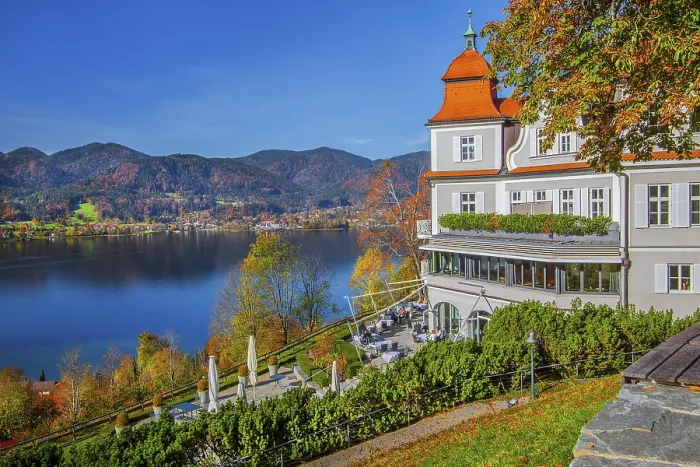 Framed Print : Hotel Das Tegernsee with sun terrace overlooking the lake in autumn Framed Print : Hotel Das Tegernsee with sun terrace overlooking the lake in autumn