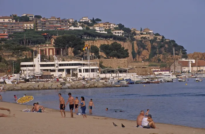 Framed Print : Houses, people, Sant Feliu de Guixols beach on the Costa Brava